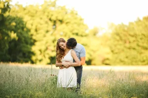 Romantic summer evening field engagement session